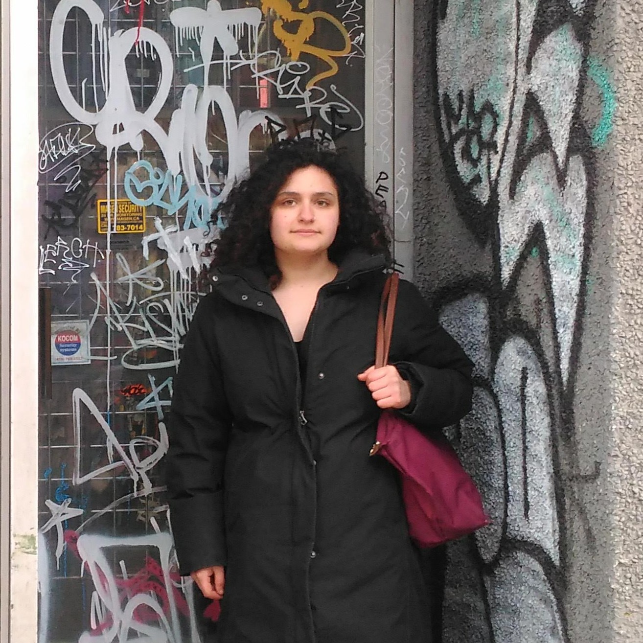 Sarah in front of graffiti